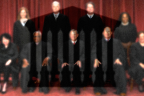 The Supreme Court justices hidden behind dotted window tint that makes them look blurry, with outline of the Court superimposed.