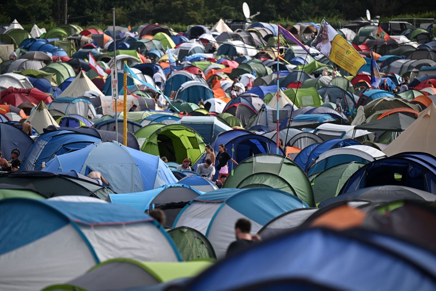 A large group of tents, set up in a field