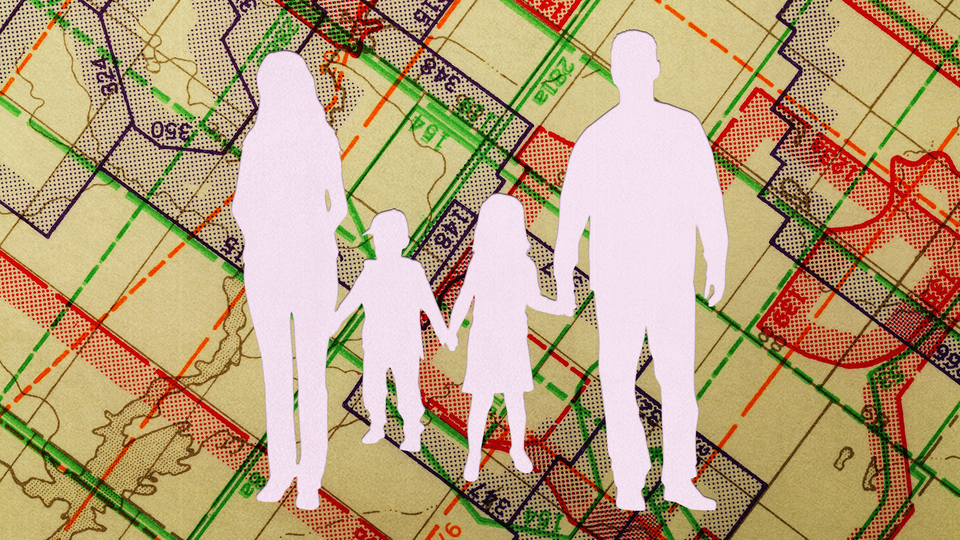 A silhouette of a nuclear family set against a map