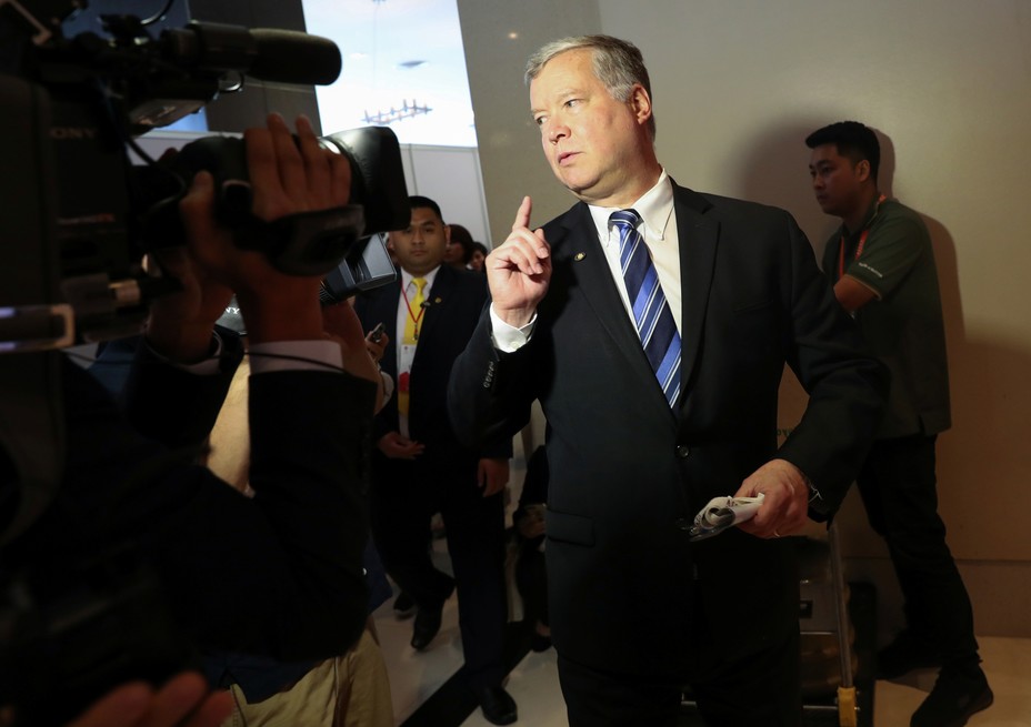 A photo of Stephen Biegun speaking to reporters.