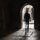 man walking out of a church door