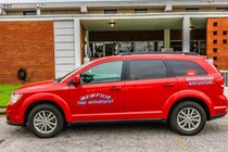 A red SUV with "Memphis Fire Department" and "Healthcare Navigator" printed on the side of the vehicle