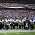 Baltimore Ravens players, including former player Ray Lewis, kneel during the playing of the U.S. national anthem before an NFL football game against the Jacksonville Jaguars at Wembley Stadium in London, Sept. 24.
