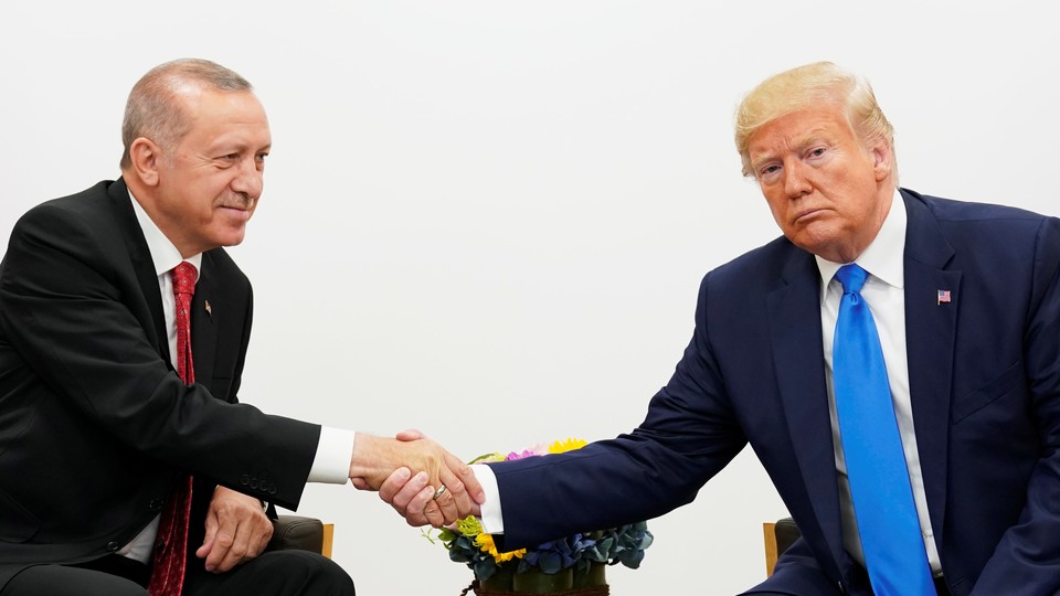 President Donald Trump and President Recep Tayyip Erdoğan shake hands.