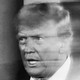 A slightly blurry black-and-white photograph of Donald Trump looking agitated