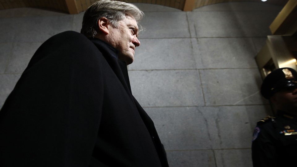 Steve Bannon walks up the stairs of the west front of the U.S. Capitol.