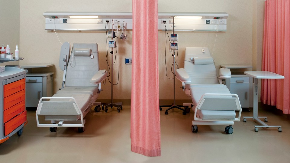 Two empty patient seats in a hospital