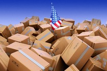 An American flag drowning in cardboard boxes