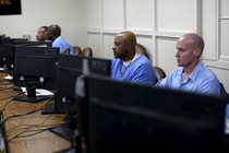 Inmates at work on computers at San Quentin