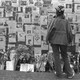 A woman looks at photos of those who went missing on September 11 in New York City.