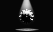 A coronavirus in a spotlight, shadowed