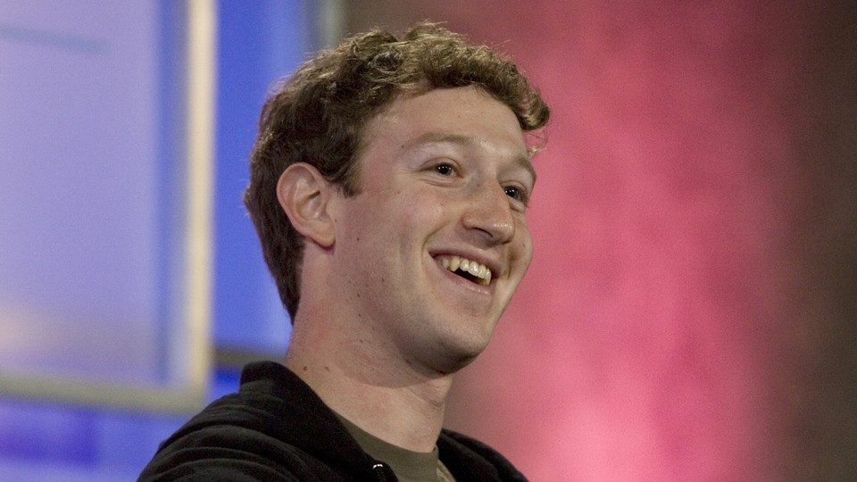 Mark Zuckerberg smiles.