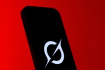 An image of a phone with the Grok logo