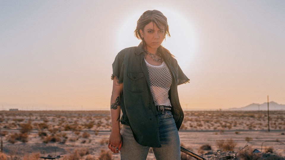 Alynda Segarra posing with desert in the background