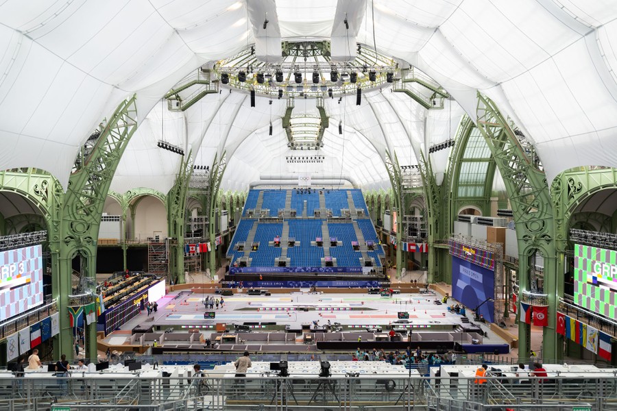 The interior of a historic exhibition hall that has been converted into a sporting arena