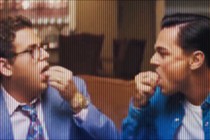 Two men in a film swallowing pills