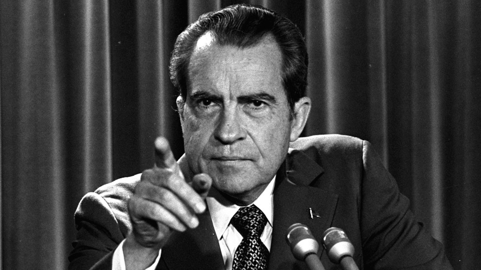 President Richard Nixon points at the camera.