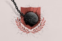 A wrecking ball smashing a shield motif.