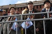 Russians at Victory Day parade holding Z flags