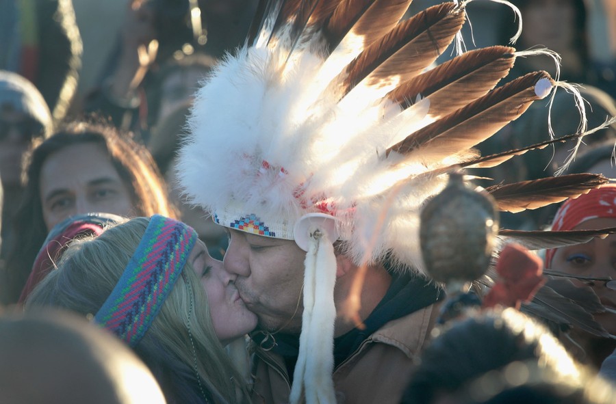 Native Americans and other activists celebrate after learning an easement had been denied for the Dakota Access Pipeline at the Oceti Sakowin Camp on December 4, 2016.