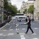 A police officer removes an electric scooter from the area around Notre-Dame cathedral in Paris.