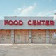 A boarded-up food store