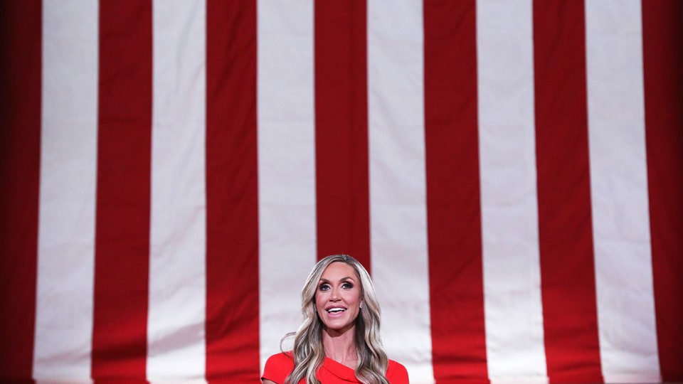 Lara Trump in front of a flag background
