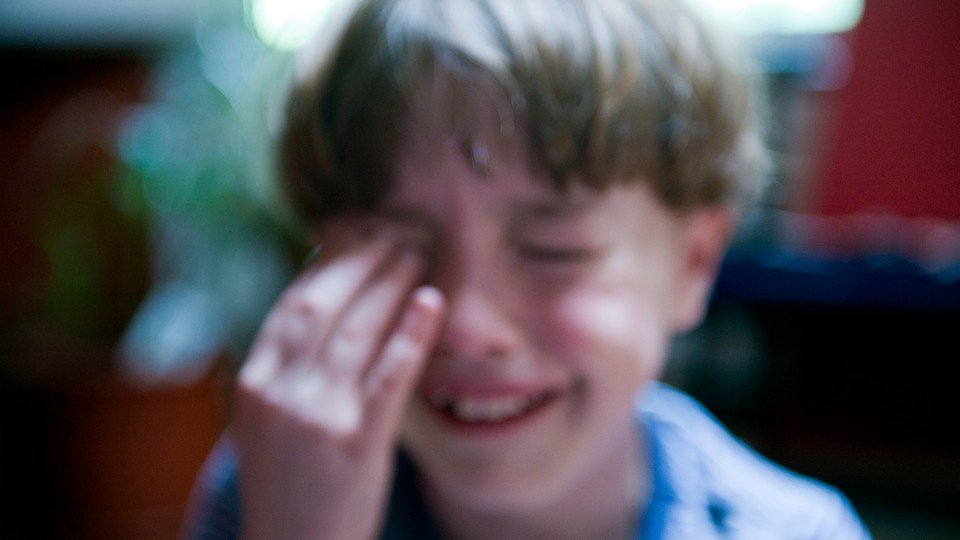 A blurry photo of a child crying