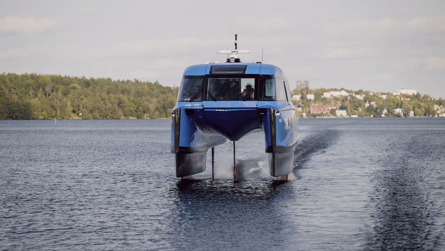 A medium-size hydrofoil vessel cruises toward the camera.