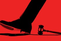 Illustration showing foot walking past judge's hammer