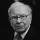 A black-and-white headshot of Warren Buffett