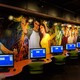 Murals of teenagers on the wall of the teen space in the Brownsville Public Library's main branch