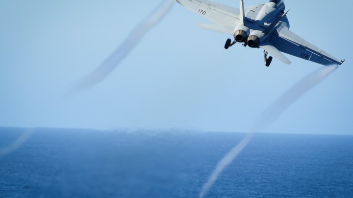 An F/A-18E Super Hornet takes off from the flight deck of the U.S. Navy aircraft carrier USS Nimitz on October 29, 2016.