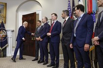 Seven leaders of AI companies and President Biden in the Roosevelt Room of the White House