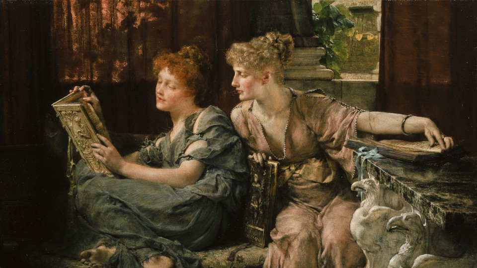 A woman reading over another woman's shoulder