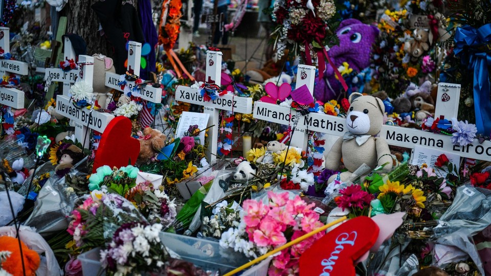 Crosses adorn a makeshift memorial for the victims of the shooting at Robb Elementary School in Uvalde, Texas.