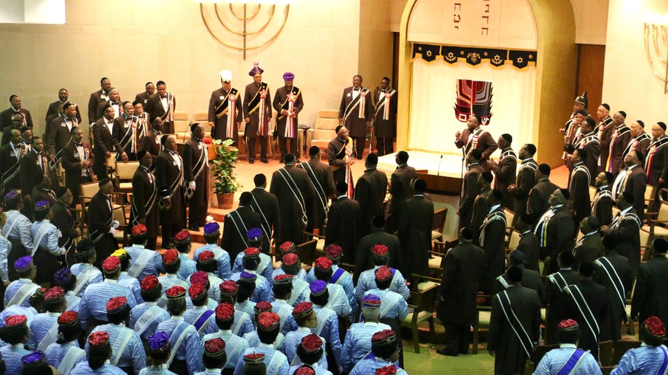 Hebrew Israelite congregants sing during Sabbath worship services, with elders and community leaders nearest the pulpit. 