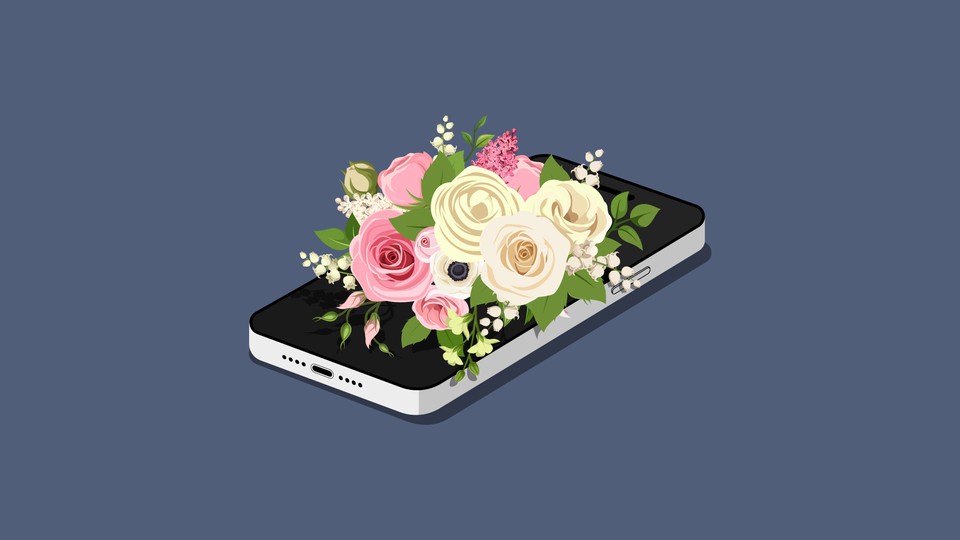 A smartphone under a bouquet of flowers