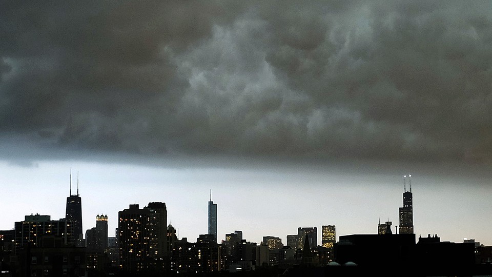 The Chicago skyline under a dark cloud