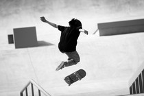 Skateboarder Miyu Sasaki performs a trick at an Olympics venue.