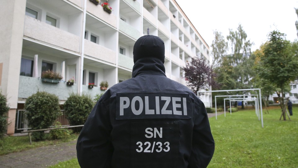 German special policemen SEK search a housing area in the eastern city of Chemnitz on suspicion that a bomb attack was being planned.
