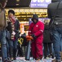 A man cleans up confetti while surrounded by tourists in Times Square in New York.