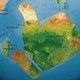 A map of a globe with a large landmass shaped like Facebook's "Like" thumbs-up sign off the coast of Africa