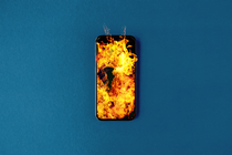 Photo-illustration of a burning phone