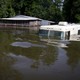 A house and RV submerged in water in Butte Larose, Louisiana in 2011. 