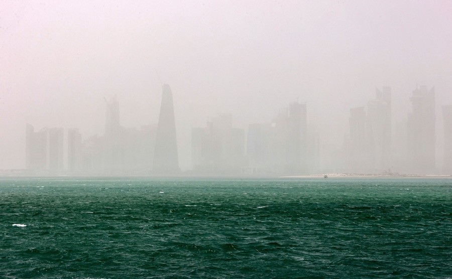 A view of skyscrapers obscured by dust