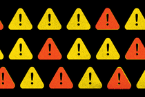 Illustration of yellow and orange triangles, each containing a black exclamation point, on a black background