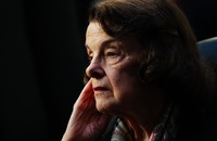 A picture of Dianne Feinstein with her hand to her cheek
