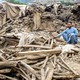 A man sits amid the ruins of an earthquake-damaged house, in Afghanistan.