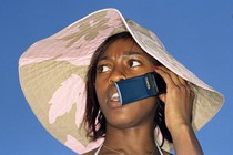 Photograph of a woman on a flip phone